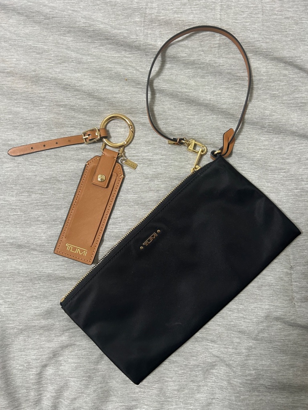 NWOT Tumi Black Wristlet with luggage tag combo